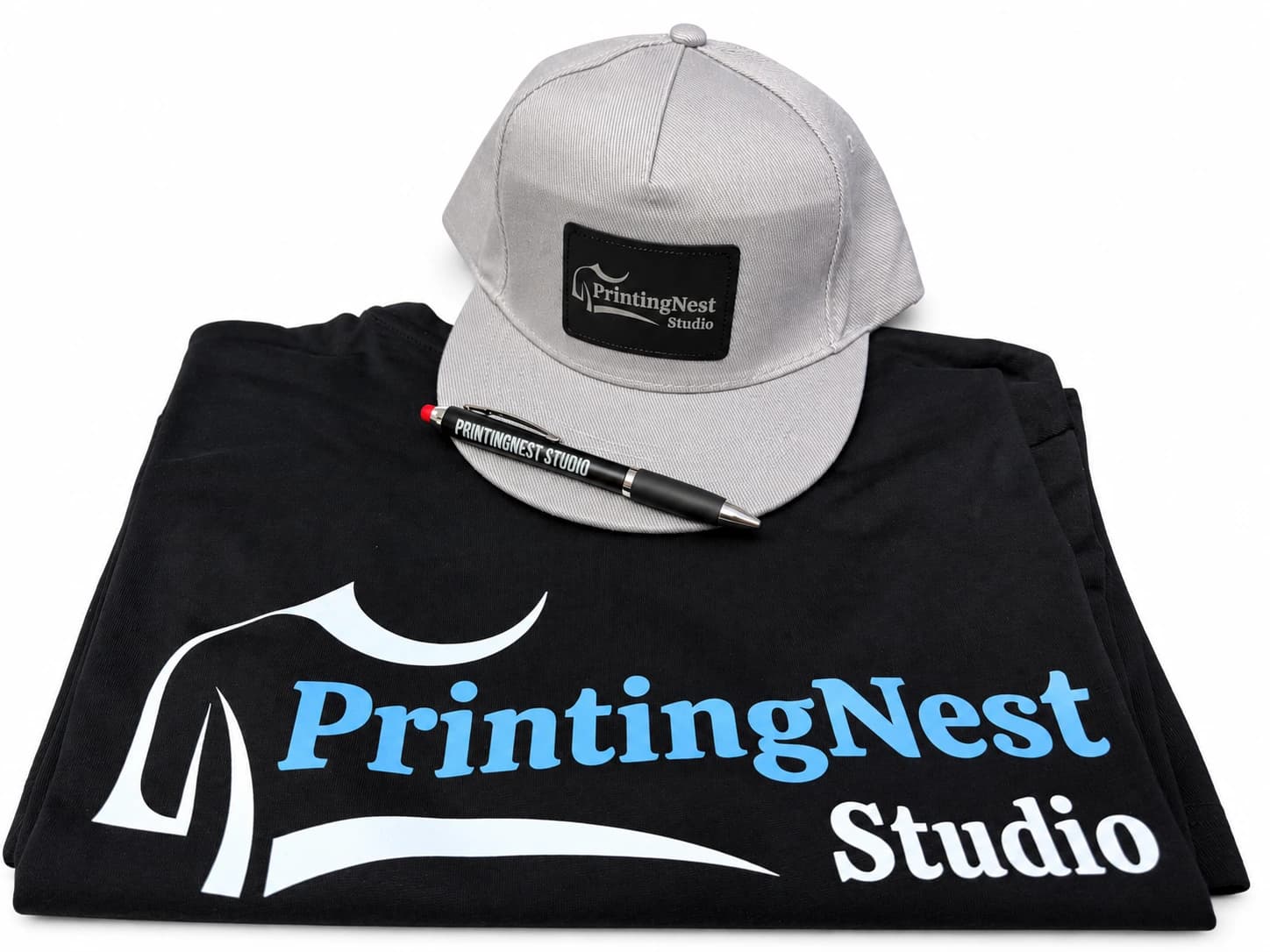 PrintingNest Studio collection: printed T-shirt, cap with an engraved patch and engraved pen